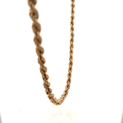 9ct yellow gold rope chain weighing 15.1g, unbranded jewelry with intricate twisted gold design on a plain background.