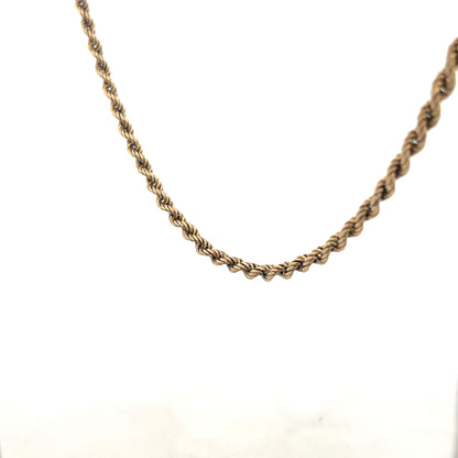9ct yellow gold rope chain weighing 7g, unbranded jewelry showing detailed twisted gold links on a white background.