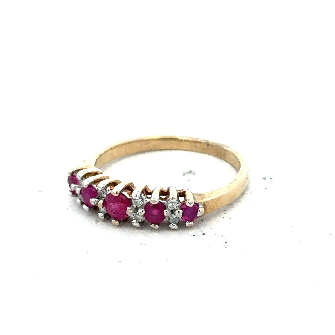 9ct yellow gold ruby and diamond ring in size J½, featuring a vibrant ruby center and sparkling diamonds.