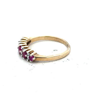 9ct yellow gold ruby and diamond ring in size J1/2, featuring a vibrant ruby center with sparkling diamonds.