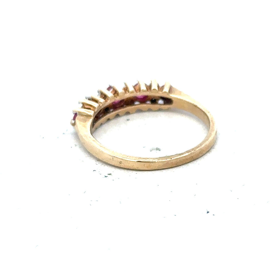 9ct yellow gold ruby and diamond ring, size J1/2, featuring vibrant rubies and sparkling diamonds on a sleek band.