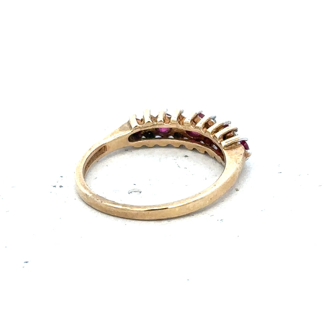 9ct yellow gold ring featuring a ruby and diamond accents, size J1/2, unbranded jewelry design.