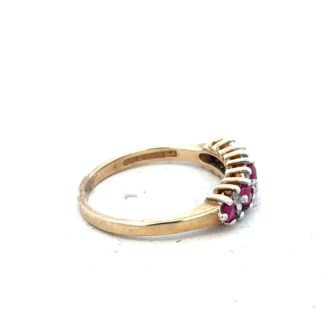 9ct yellow gold ruby and diamond ring size J1/2 featuring a vibrant ruby and sparkling diamonds on an elegant gold band.