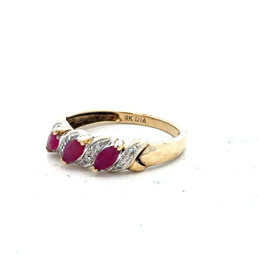 9ct yellow gold ruby and diamond ring, size L, featuring a central ruby surrounded by sparkling diamonds.