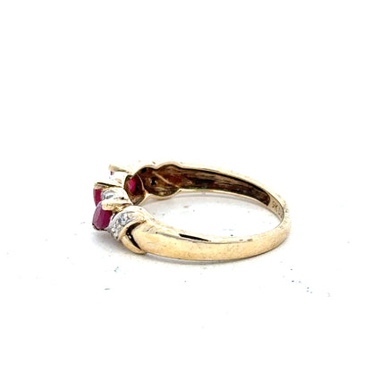 9ct yellow gold ruby and diamond ring in size L, showcasing a vibrant ruby centerpiece with sparkling diamonds.