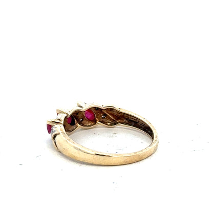 9ct yellow gold ring featuring a central ruby and diamond accents, size L, with an elegant and classic design.