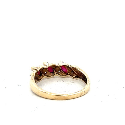 9ct yellow gold ruby and diamond ring in size L, featuring a central ruby surrounded by sparkling diamonds.