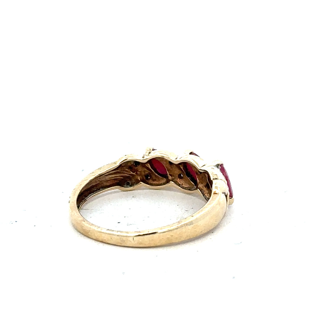 9ct yellow gold ruby and diamond ring in size L, featuring a central ruby with accent diamonds, unbranded jewelry.