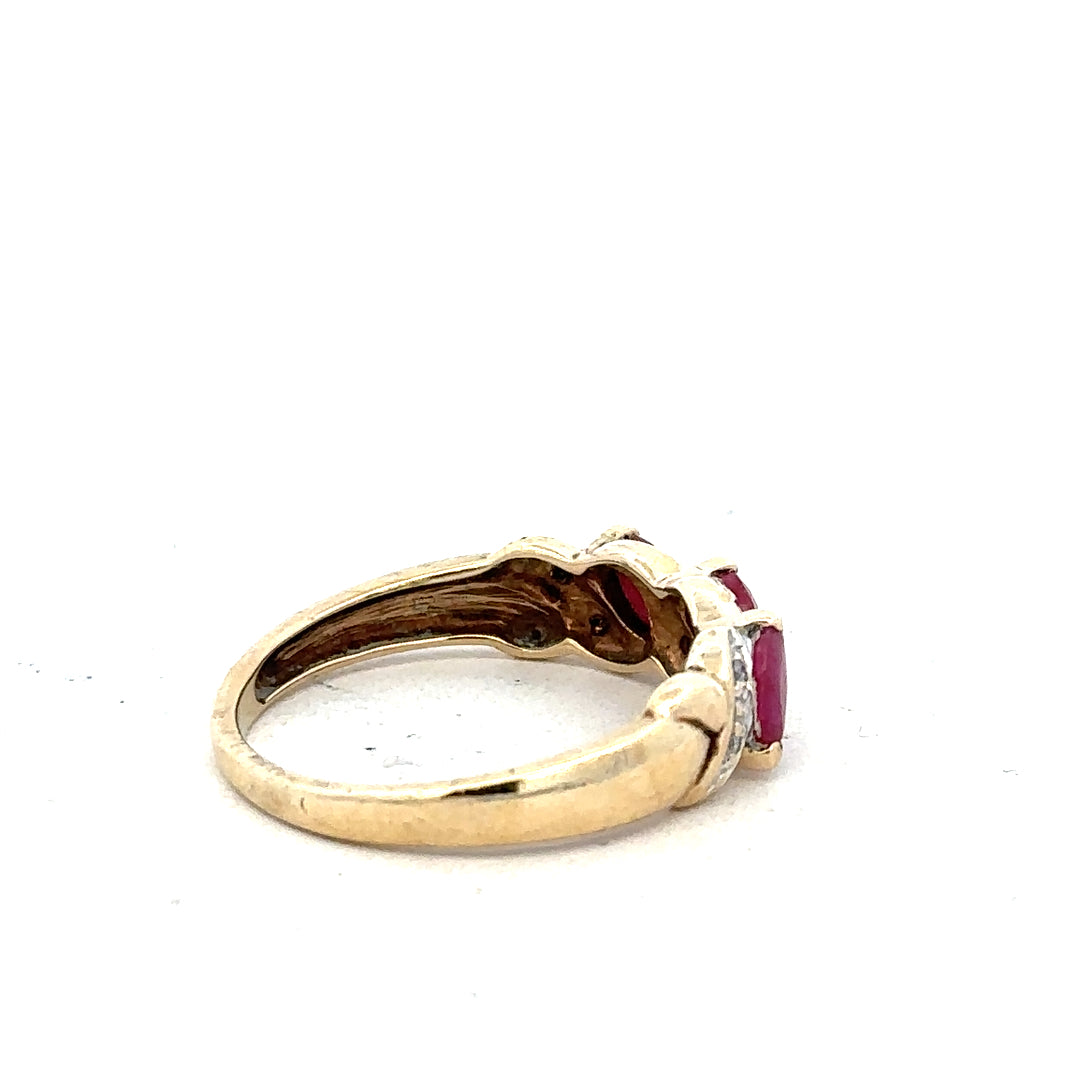 9ct yellow gold ruby and diamond ring in size L, featuring a vibrant ruby centerpiece with sparkling diamonds.