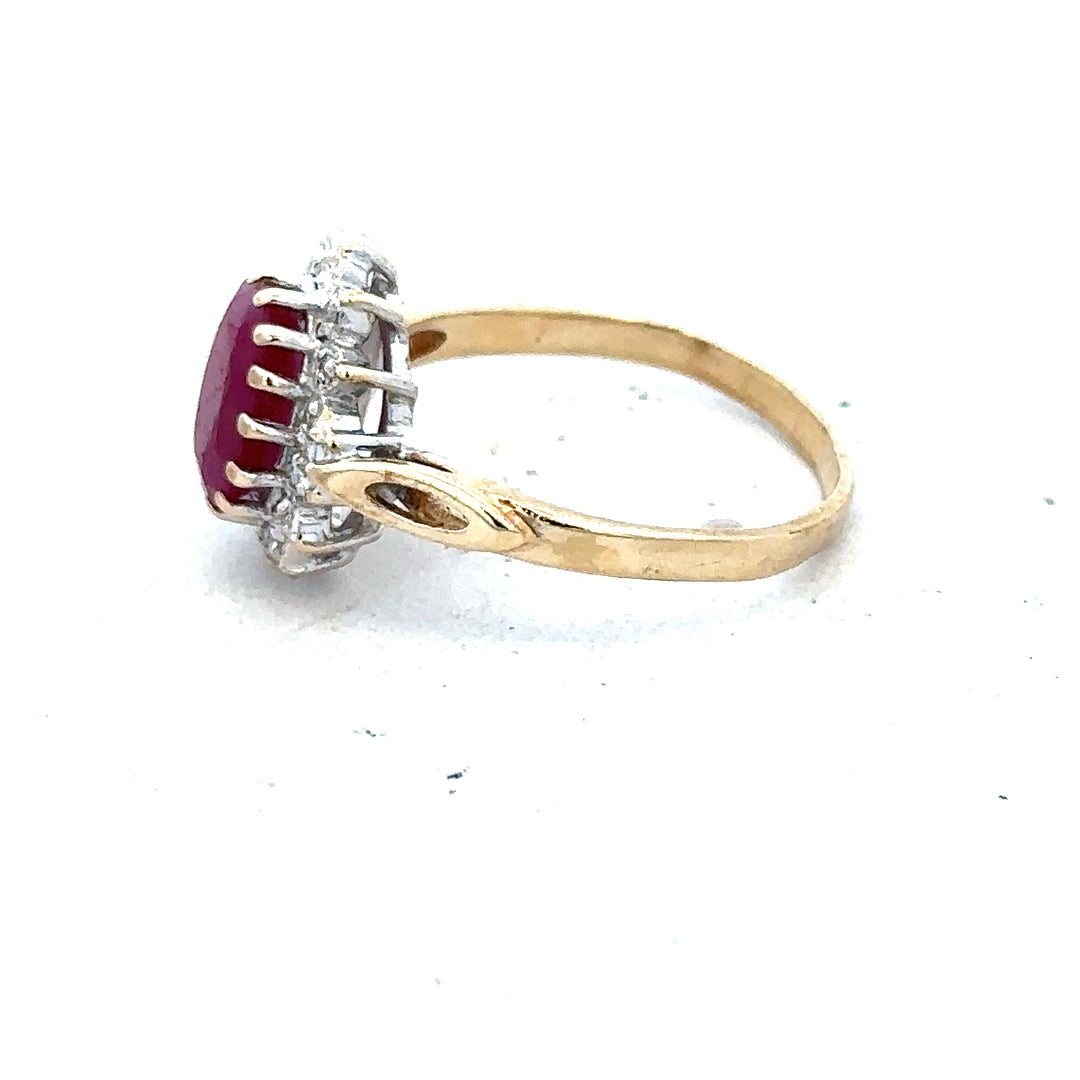 9ct yellow gold ruby and diamond ring in size L, featuring a vibrant ruby center with sparkling diamonds.