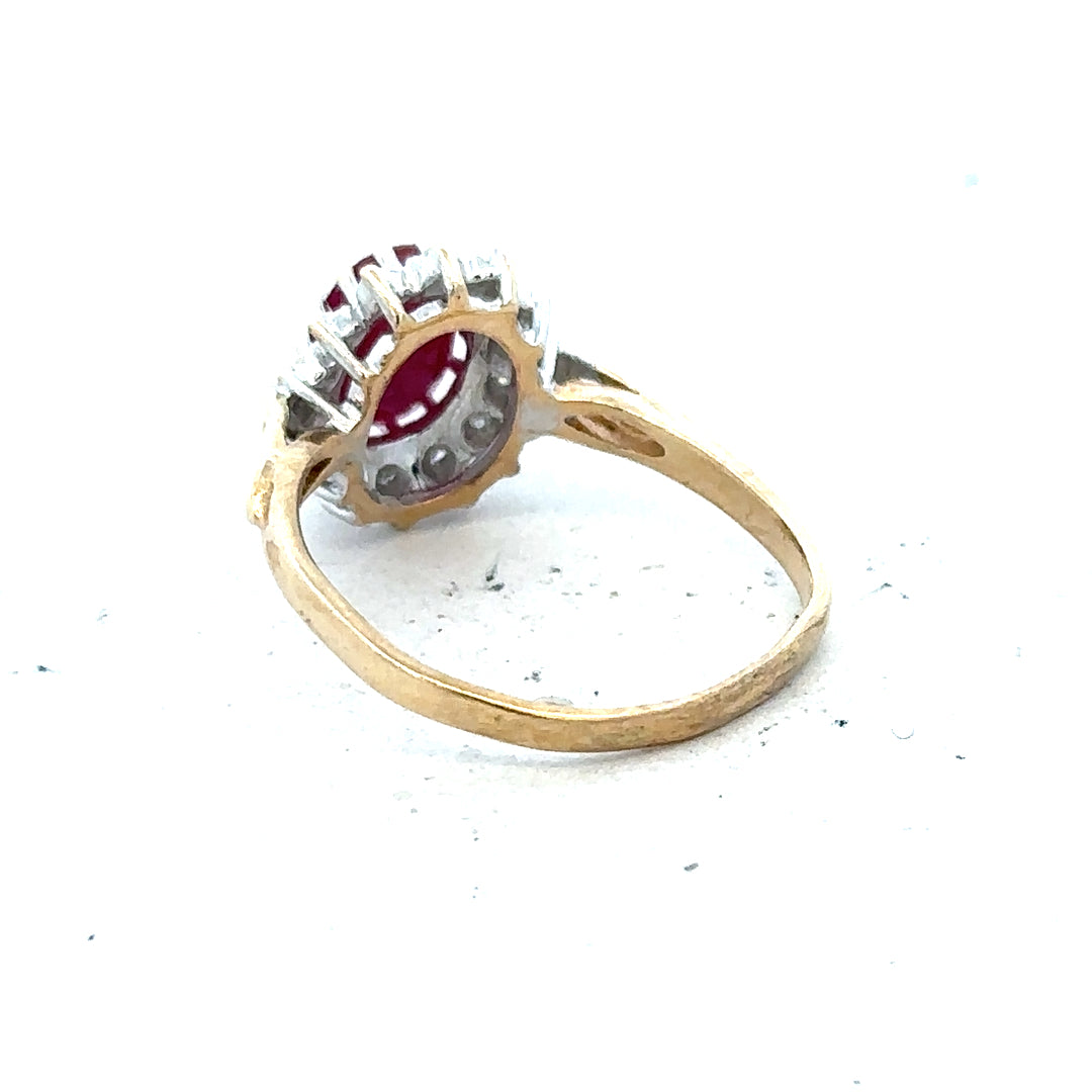 9ct yellow gold ruby and diamond ring, size L, featuring vibrant rubies and sparkling diamonds on a sleek gold band.