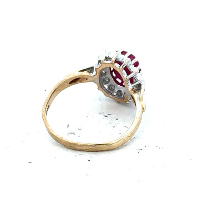 9ct yellow gold ruby and diamond ring in size L, featuring a central ruby surrounded by diamonds, elegant jewelry design.