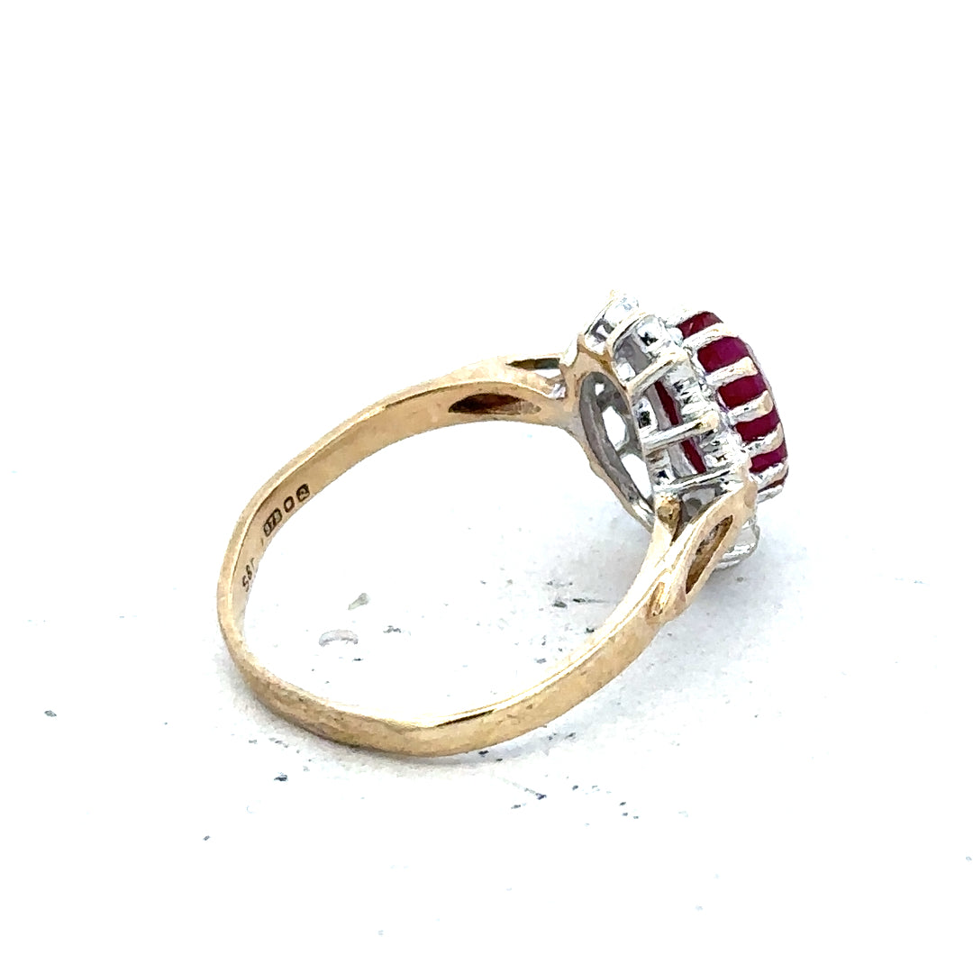 9ct yellow gold ruby and diamond ring, size L, featuring a central ruby and sparkling diamonds on a classic band.
