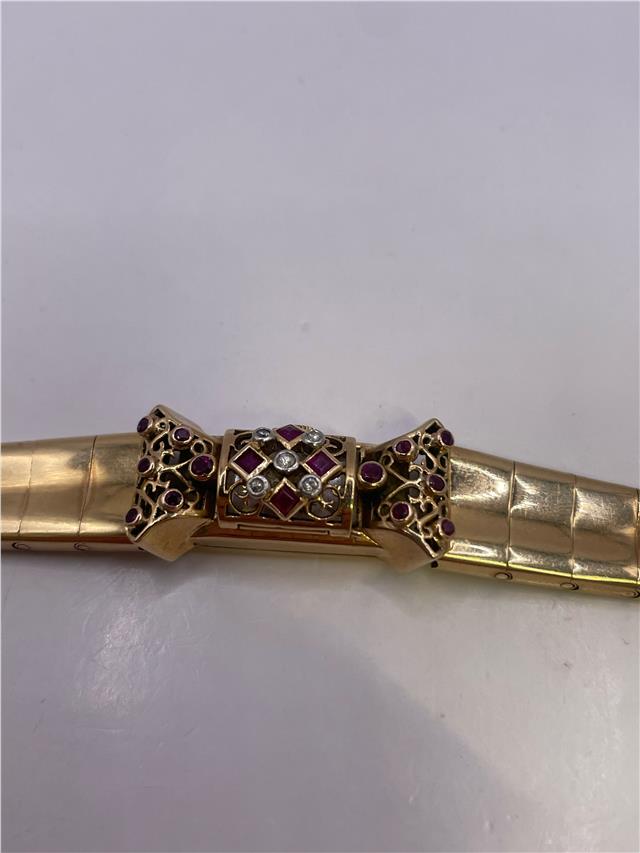 9ct yellow gold ruby and diamond watch with a sleek design, weighing 34.3g, unbranded, featuring a classic and elegant look.