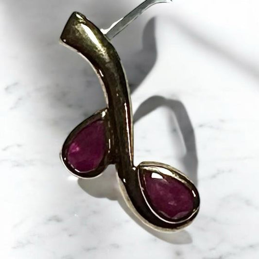 9ct yellow gold ruby pendant weighing 1.2g, featuring a vibrant ruby gemstone set in an elegant pendant design.