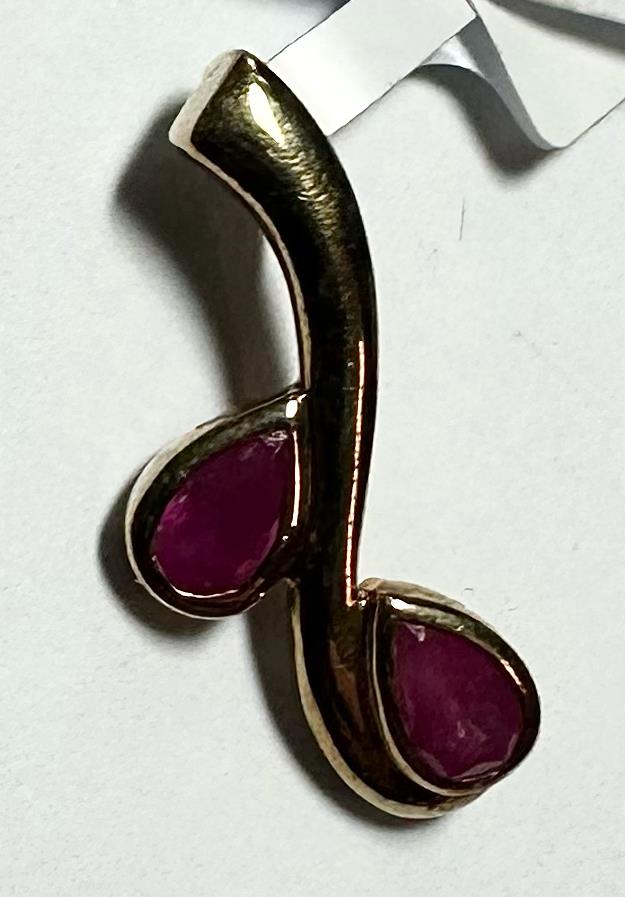 9ct yellow gold ruby pendant weighing 1.2g, featuring a vibrant ruby gemstone, designed for elegant jewelry collection.