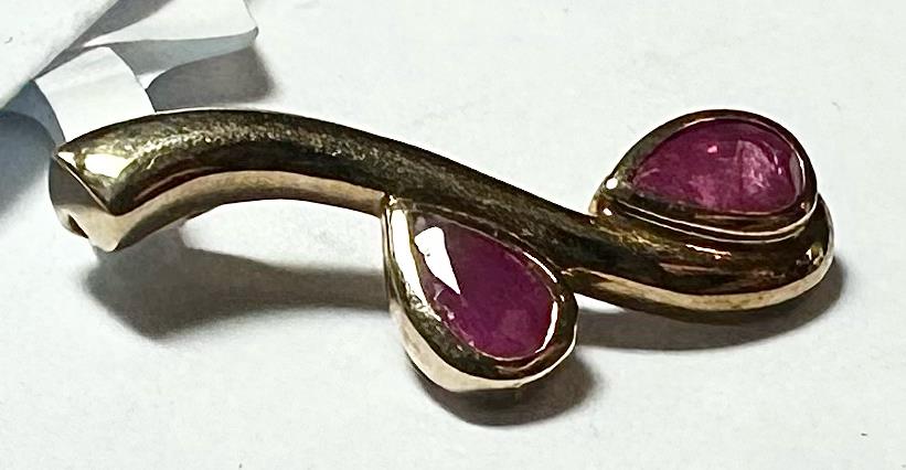 9ct yellow gold ruby pendant with a polished finish, showcasing a vibrant ruby gemstone in an unbranded jewelry image.