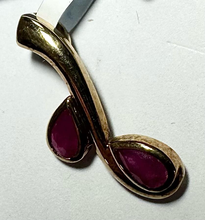 9ct yellow gold ruby pendant weighs 1.2g, featuring a vibrant ruby gemstone and a classic design, unbranded jewelry accessory.