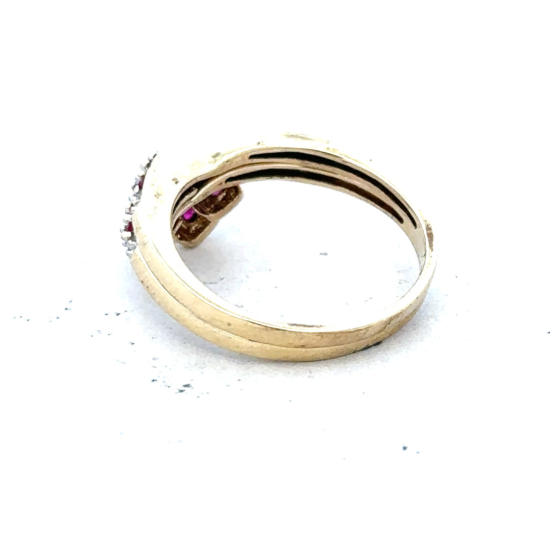 9ct yellow gold ruby ring in size O, featuring a central red ruby gemstone and elegant gold band.