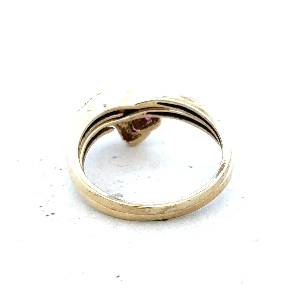 9ct yellow gold ruby ring in size O with a central ruby gemstone, displayed on a neutral background.