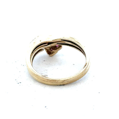 9ct yellow gold ruby ring in size O with a central ruby gemstone, displayed on a neutral background.