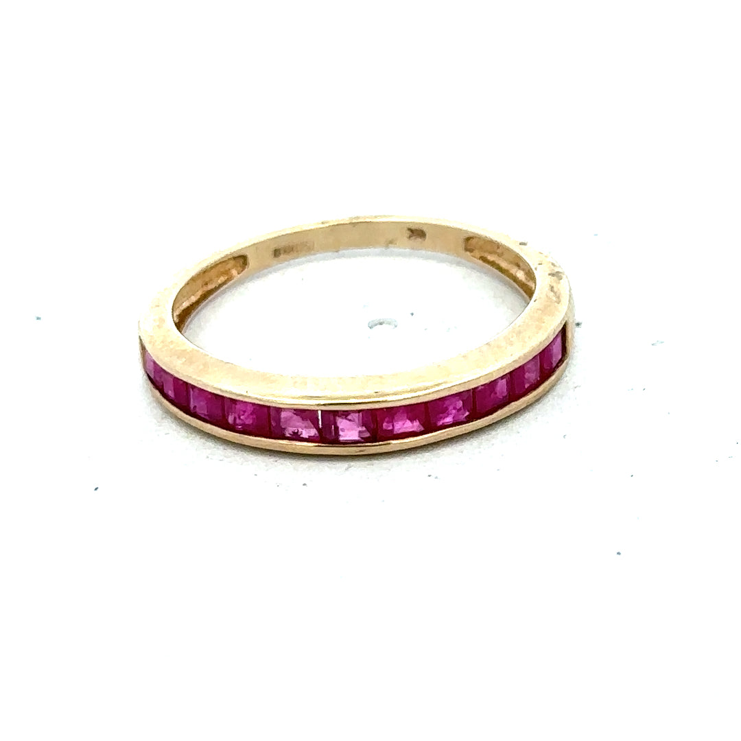 9ct yellow gold ruby ring in size P1/2, featuring a central red ruby gemstone and a polished gold band.
