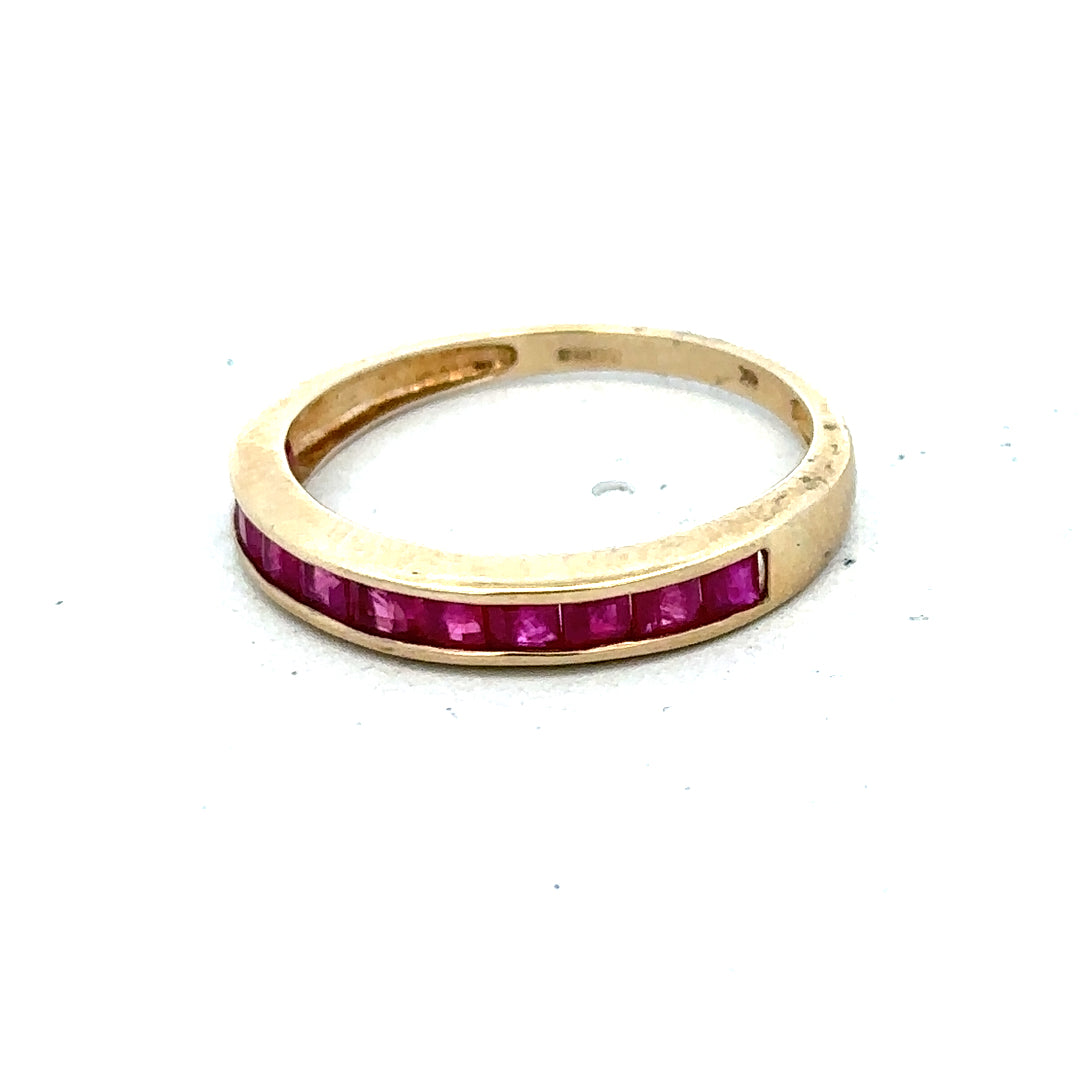 9ct yellow gold ruby ring size P1/2 with a central ruby gemstone, unbranded jewelry displayed on a neutral background.
