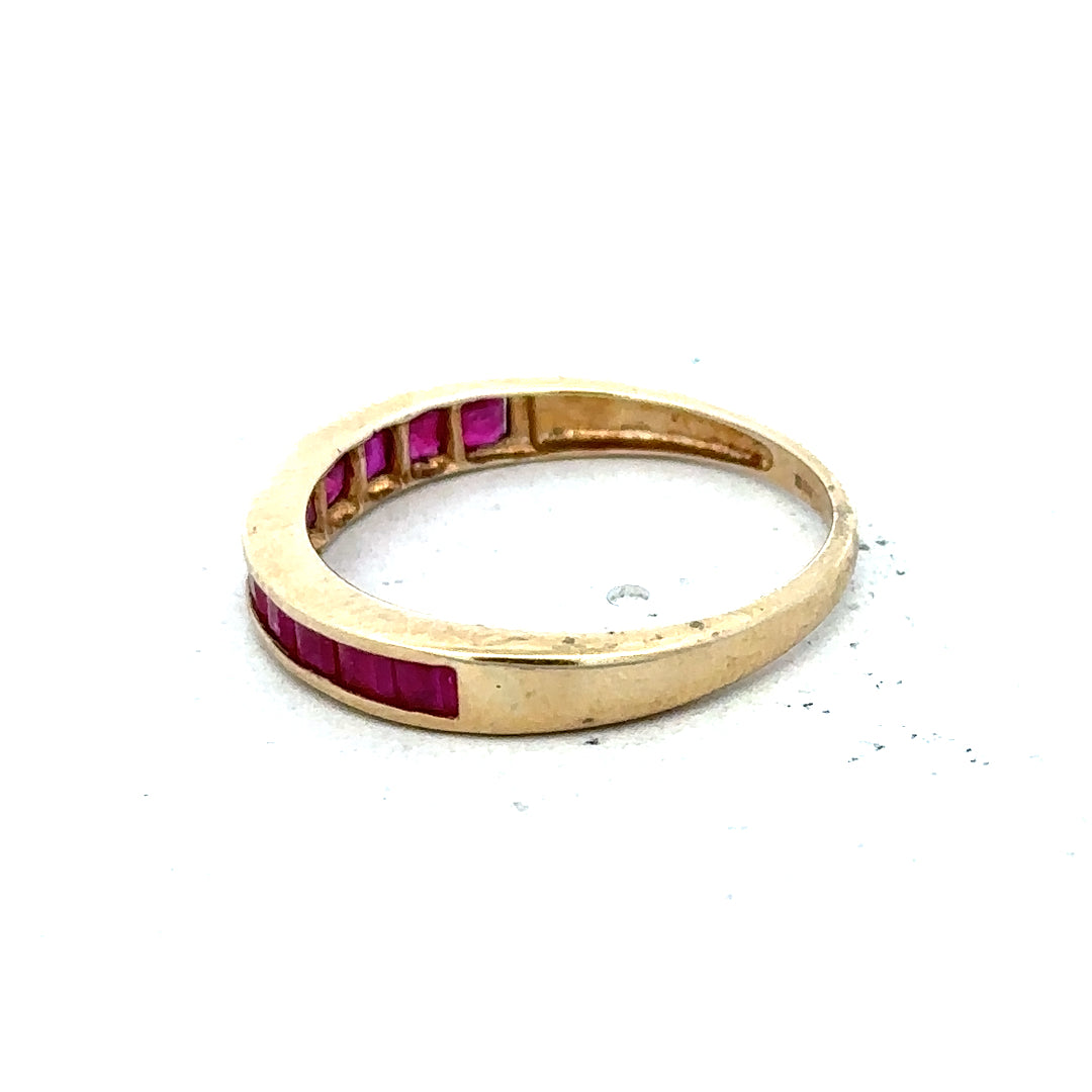9ct yellow gold ruby ring in size P1/2 featuring a vibrant red ruby gemstone and a polished gold band.