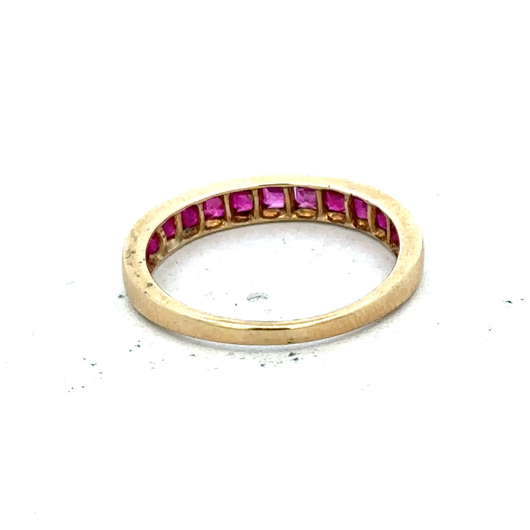 9ct yellow gold ruby ring in size P1/2, featuring a vibrant red ruby gemstone set in a polished gold band.