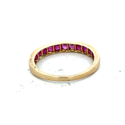 9ct yellow gold ruby ring in size P1/2, featuring a vibrant red ruby gemstone set in a polished gold band.