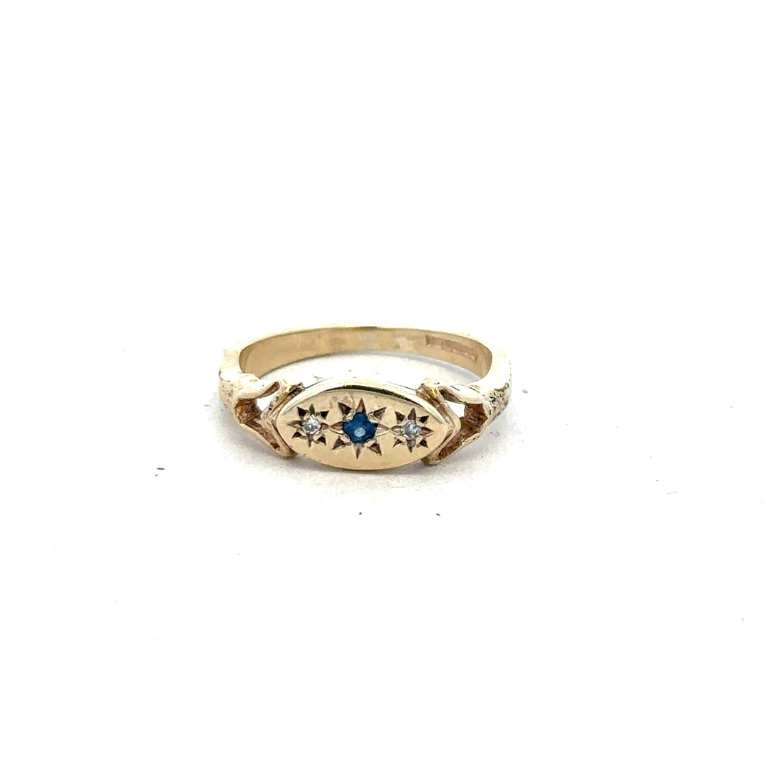 9ct yellow gold sapphire and diamond ring, size K, featuring a central sapphire surrounded by small diamonds.