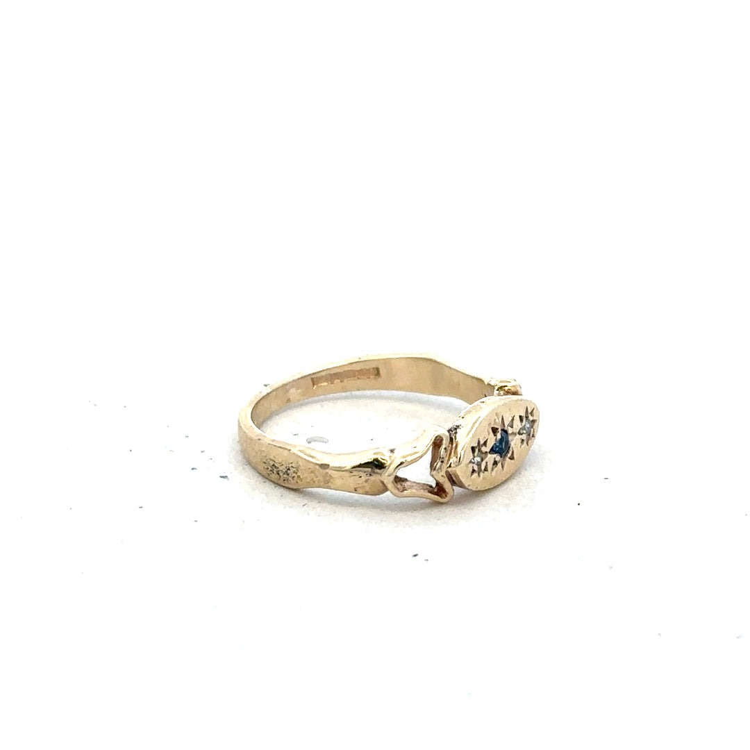 9ct yellow gold sapphire and diamond ring in size K, featuring a detailed close-up of the jewelry design.