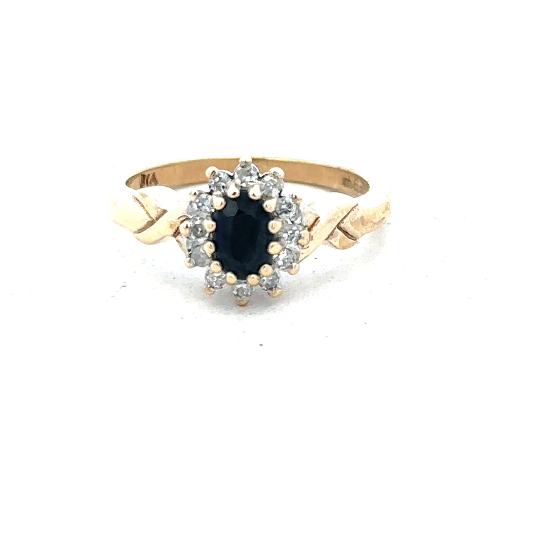 9ct yellow gold sapphire and diamond ring in size K1/2, featuring a detailed design and sparkling gemstones.
