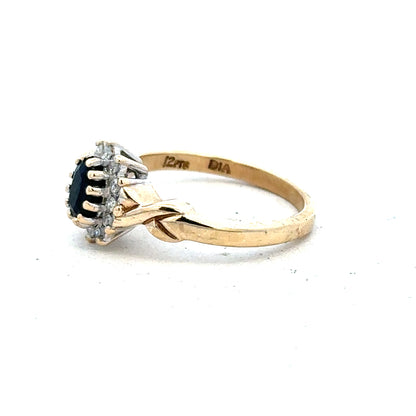 9ct yellow gold sapphire and diamond ring in size K1/2, featuring a detailed view of the elegant gemstone setting.
