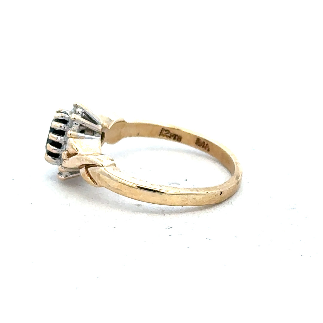 9ct yellow gold sapphire and diamond ring in size K1/2, featuring a central sapphire with diamond accents on the band.