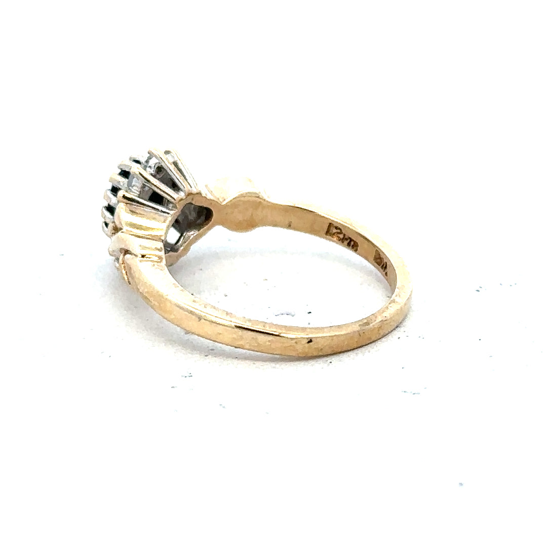 Gold sapphire and diamond ring in 9ct yellow gold, size K½, featuring a central sapphire and diamond accents.
