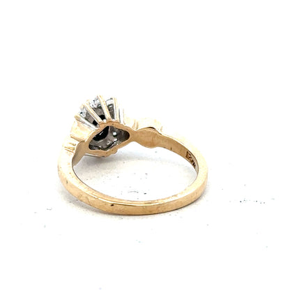 9ct yellow gold sapphire and diamond ring, size K1/2, showcasing a central sapphire surrounded by sparkling diamonds.