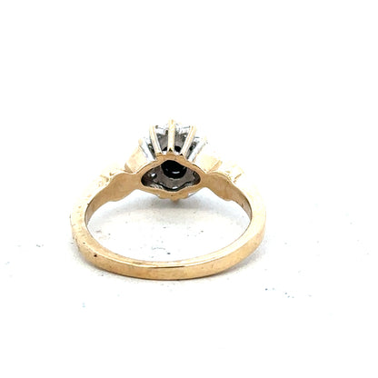 9ct yellow gold sapphire and diamond ring, size K1/2, featuring a detailed design with sparkling gemstones.