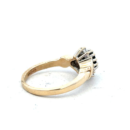 9ct yellow gold sapphire and diamond ring in size K1/2, featuring a central sapphire with diamond accents.
