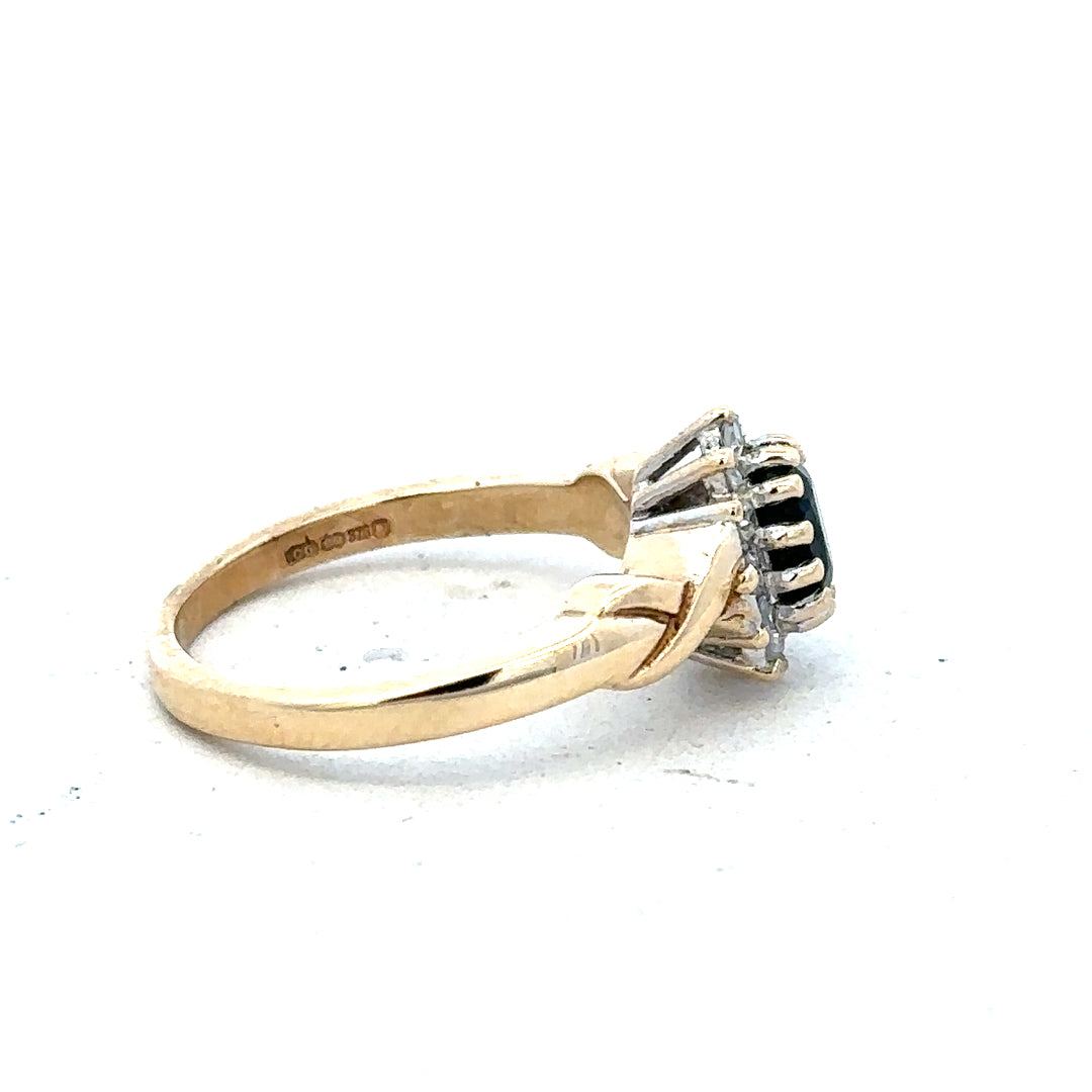 9ct yellow gold sapphire and diamond ring in size K1/2, featuring a stunning central sapphire with sparkling diamonds.