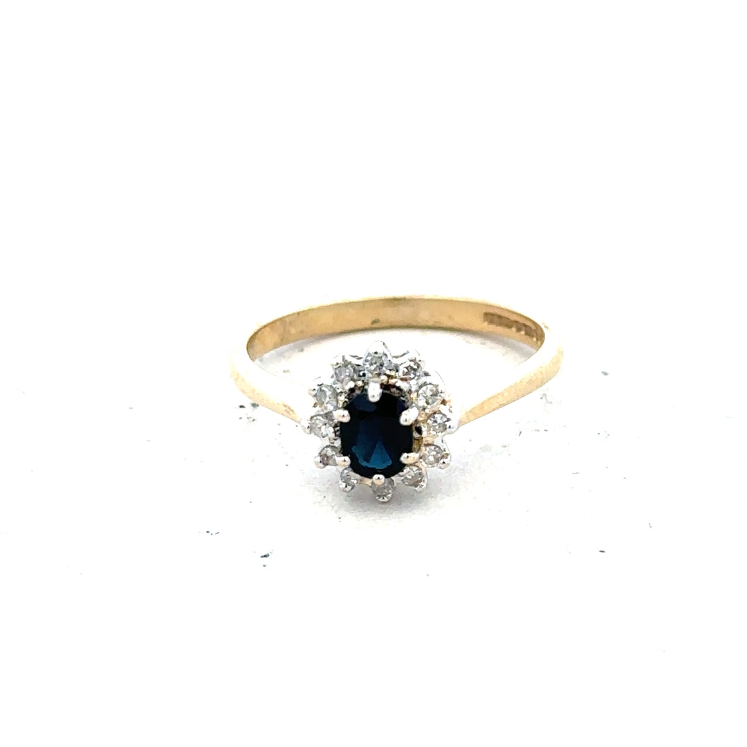 9ct yellow gold sapphire and diamond ring, size L, showcasing a sparkling gemstone and elegant design.