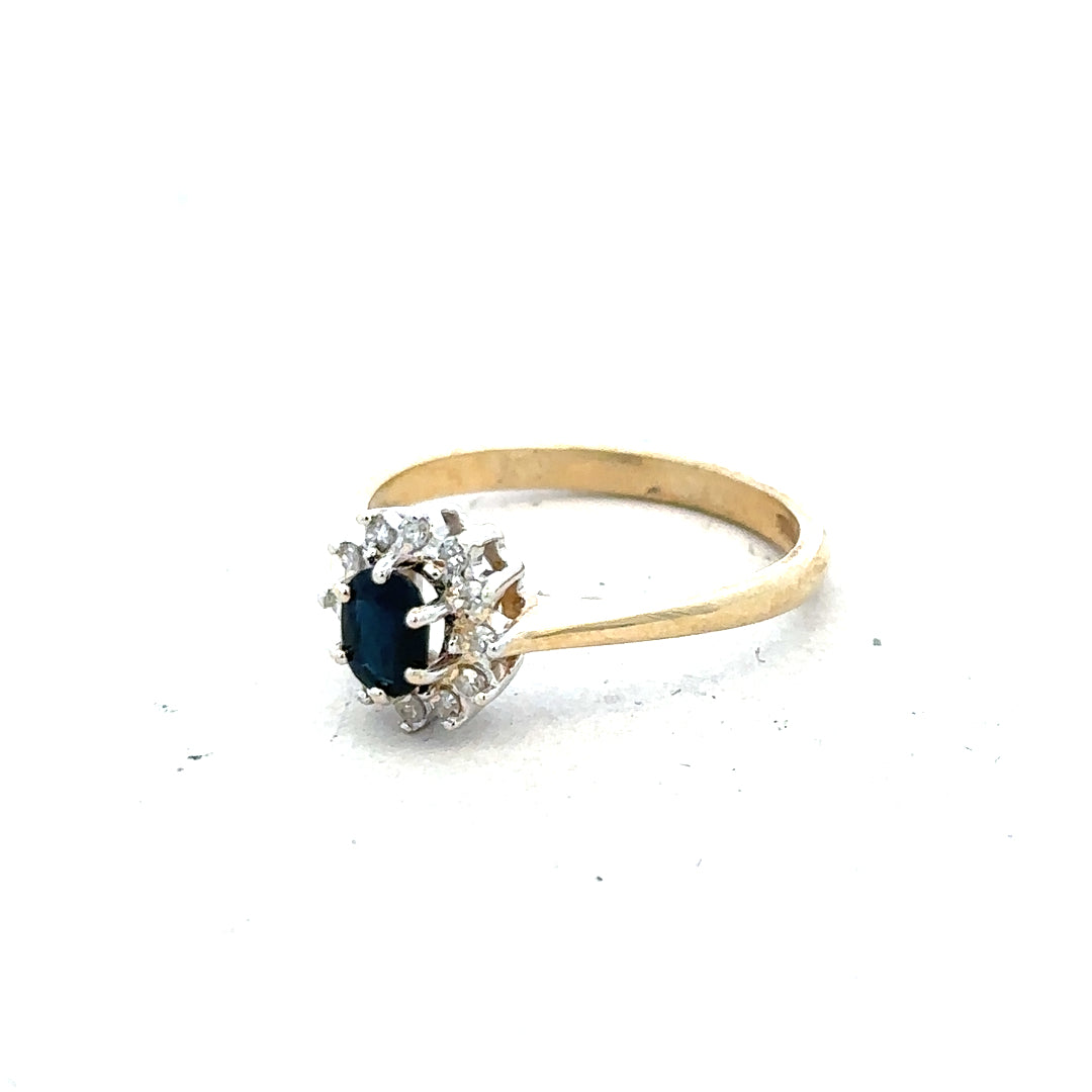 9ct yellow gold sapphire and diamond ring, size L, featuring a vibrant sapphire centerpiece with diamond accents.