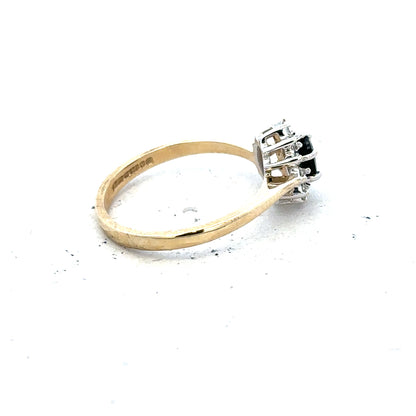 9ct yellow gold sapphire and diamond ring in size L, featuring a central sapphire with diamond accents on a sleek band.