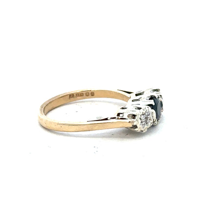9ct yellow gold sapphire and diamond ring, size L1/2, featuring a polished band and sparkling gemstones.
