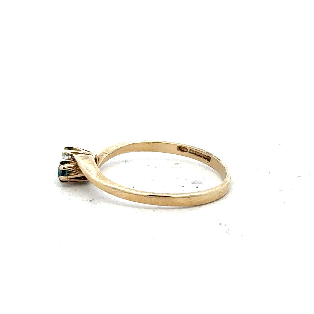 9ct yellow gold sapphire and diamond ring in size M with intricate design, featuring a vibrant blue sapphire centerpiece.