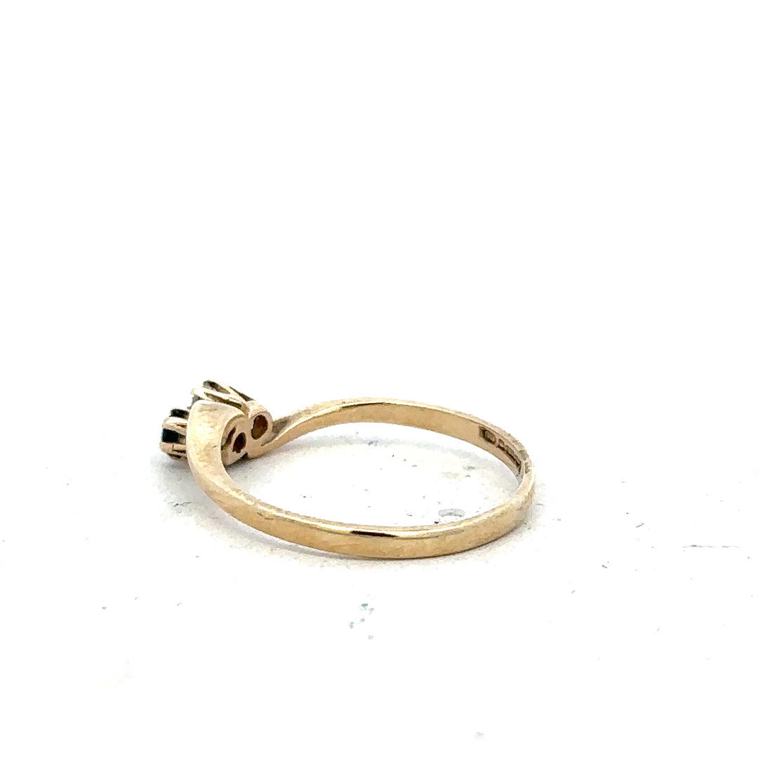 9ct yellow gold sapphire and diamond ring in size M, featuring a polished band with a central sapphire and sparkling diamonds.