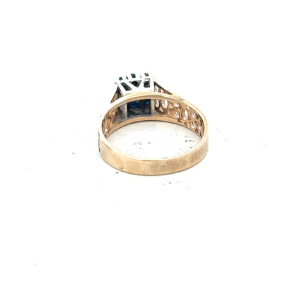 9ct yellow gold sapphire and diamond ring, size N1/2, featuring a vibrant blue sapphire and sparkling diamonds.