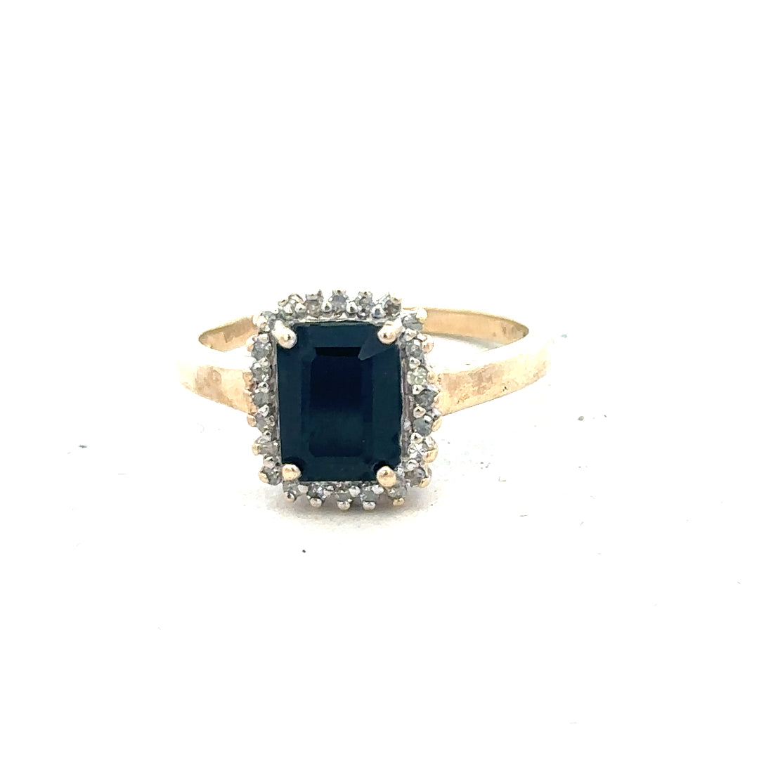 9ct yellow gold sapphire and diamond ring, size O, featuring a polished band and intricate gemstone setting.