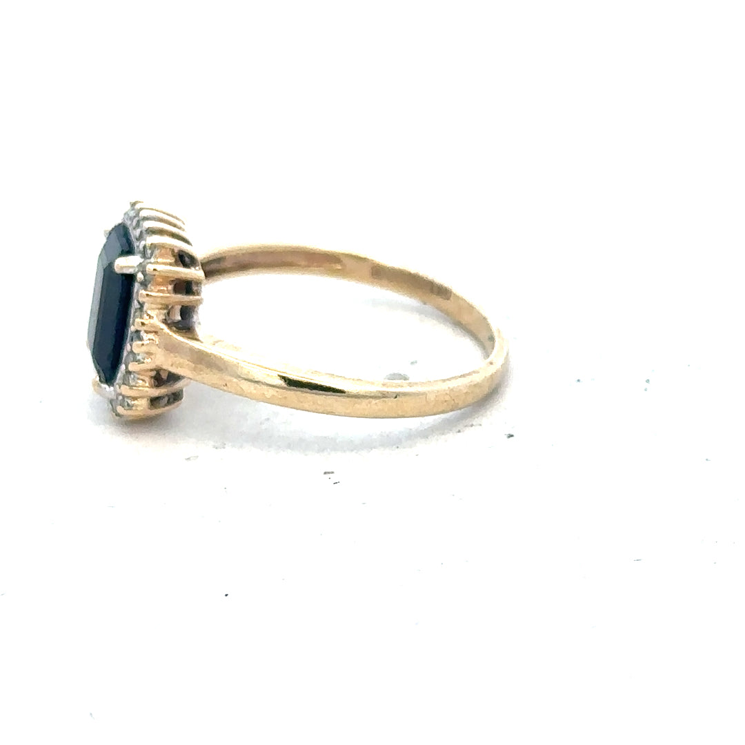 9ct yellow gold sapphire and diamond ring in size O, featuring a detailed design with sparkling gemstones.