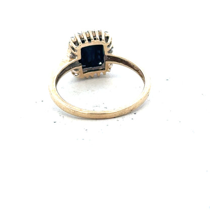 9ct yellow gold sapphire and diamond ring in size O, featuring a detailed design with sparkling gemstones.